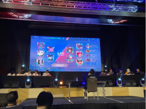 Image of people playing a mobile game on stage