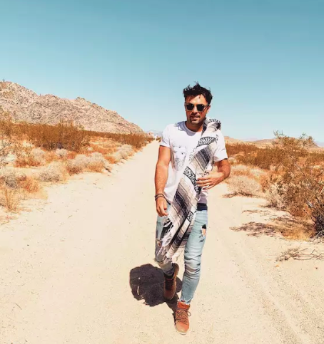 man walking in the desert