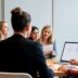 Professionals collaborating on a marketing strategy in a meeting.