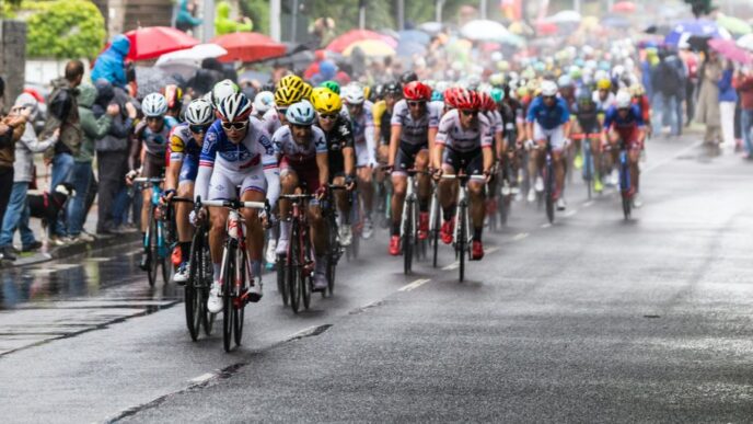 people riding bicycle on road during daytime