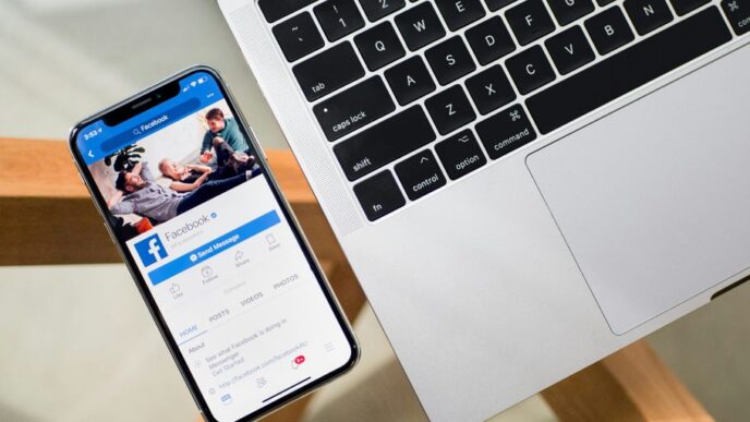 iPhone X beside MacBook