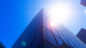 Futuristic skyscraper against a clear blue sky.