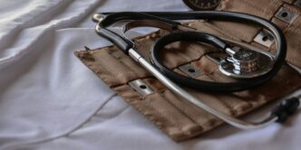 black stethoscope with brown leather case