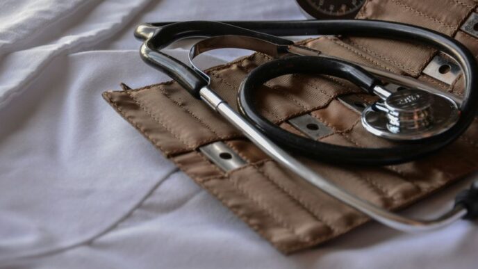 black stethoscope with brown leather case