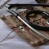 black stethoscope with brown leather case