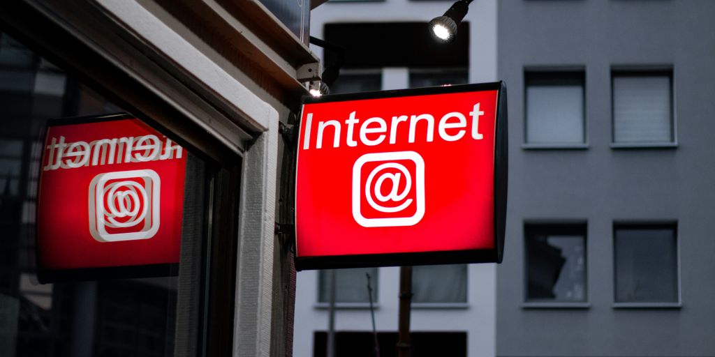 Internet LED signage beside building near buildings