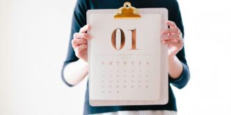 person holding calendar at January