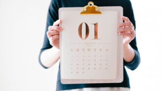 person holding calendar at January