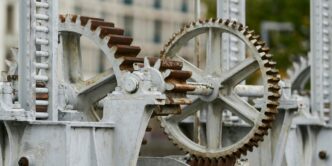 selective focus photography of machine with gears