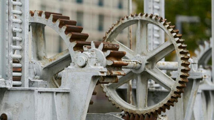 selective focus photography of machine with gears