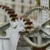 selective focus photography of machine with gears