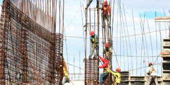 people working on building during daytime