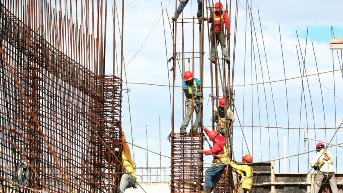 people working on building during daytime