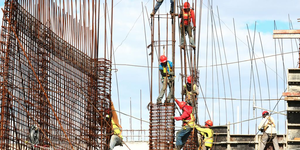 people working on building during daytime