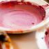 white and red ceramic bowl