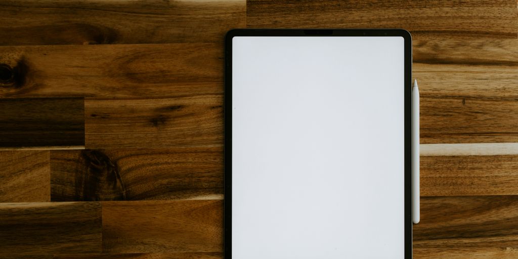 white rectangular frame on brown wooden table
