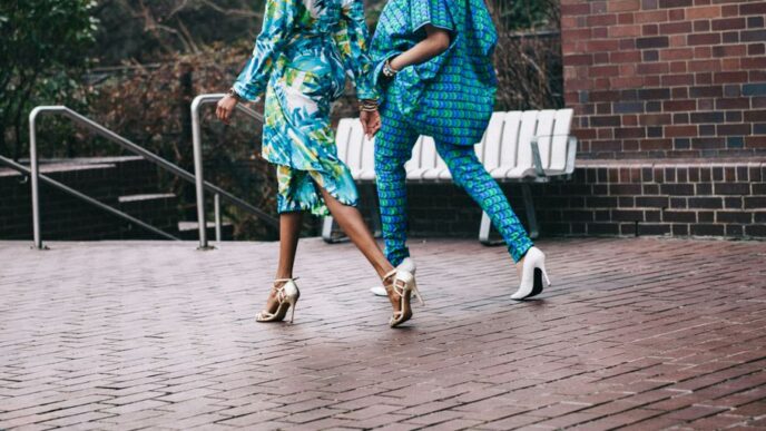 two women in teal romper pants