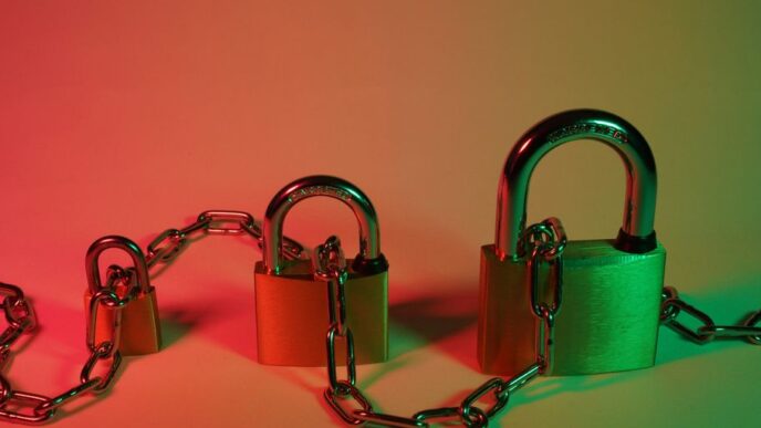 green padlock on pink surface