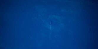white light bulb on blue sky