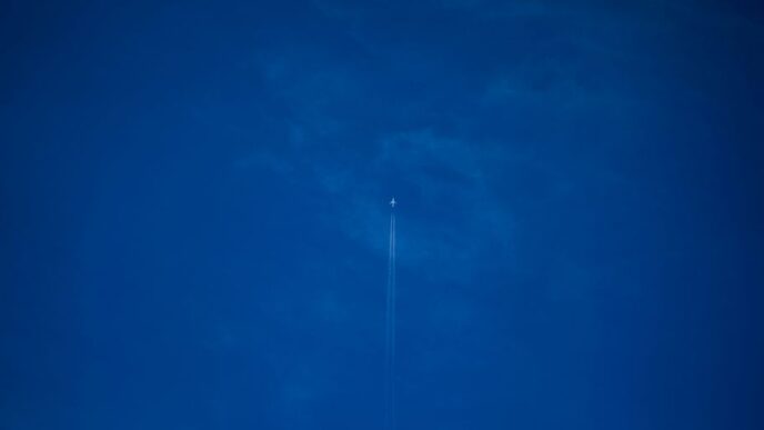 white light bulb on blue sky