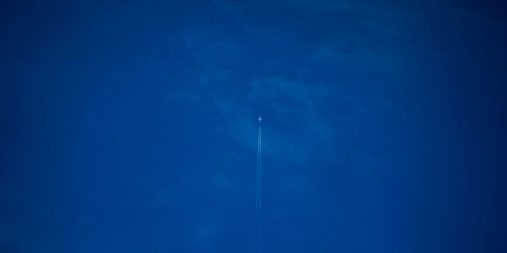 white light bulb on blue sky