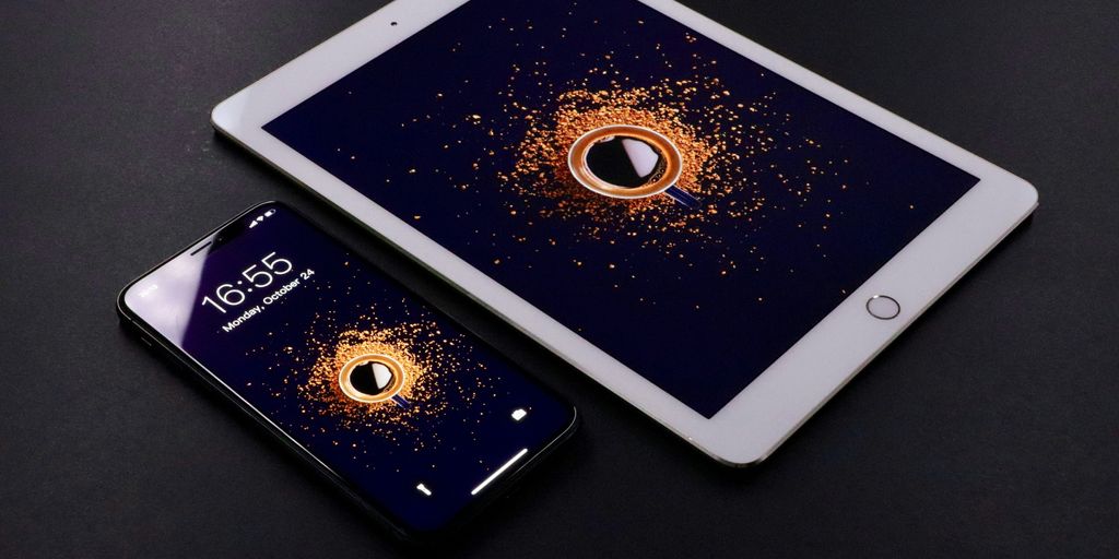 gold Apple iPad and black smartphone
