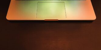 macbook pro on brown wooden table