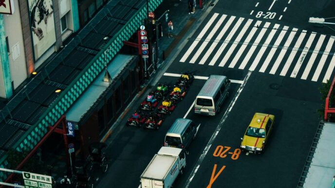 cars on road near buildings during night time