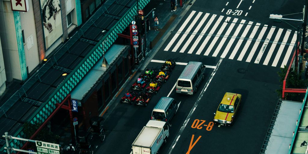 cars on road near buildings during night time