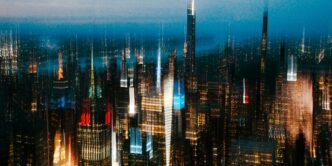 Blurred cityscape with bright lights at night.