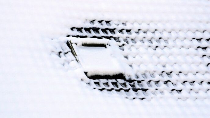 a close up of a cell phone in the snow