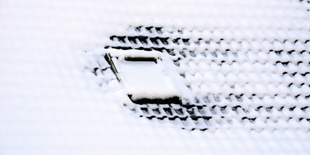 a close up of a cell phone in the snow