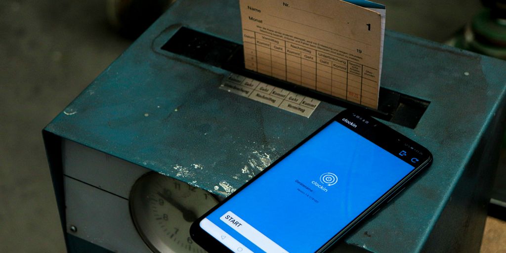 a cell phone sitting on top of a metal box