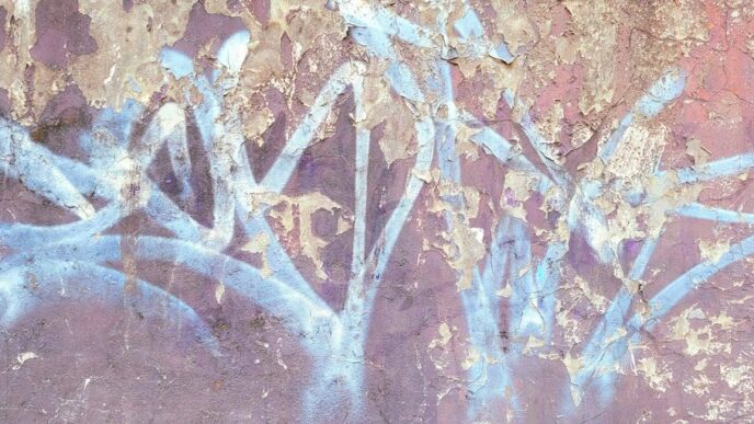 a painting of a flower on the side of a wall