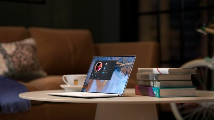 laptop on brown wooden table