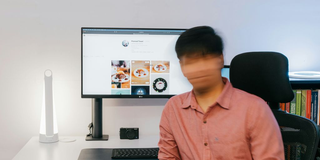 a person sitting in front of a computer