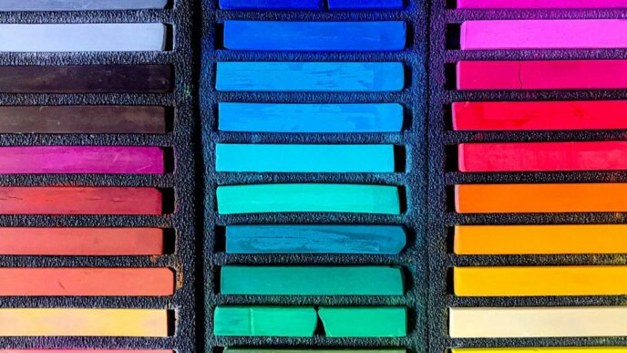 a box filled with lots of different colored crayons