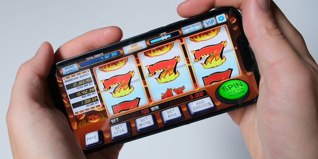 Someone is playing a mobile slot machine game.