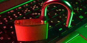 red padlock on black computer keyboard