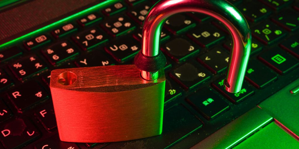 red padlock on black computer keyboard