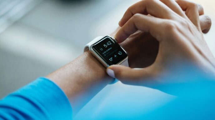 person clicking Apple Watch smartwatch