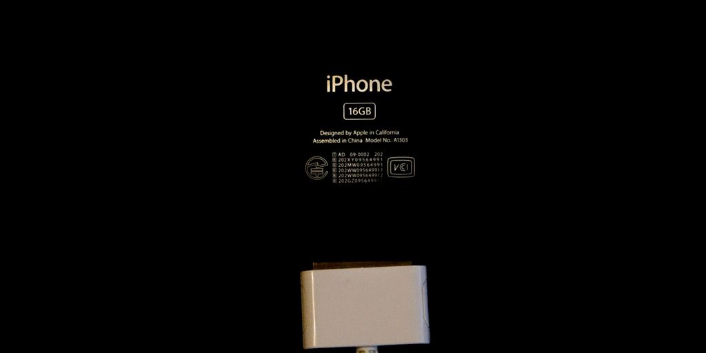 an iphone is plugged in to a charger