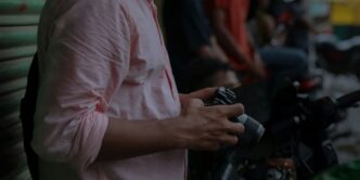 a man holding a watch