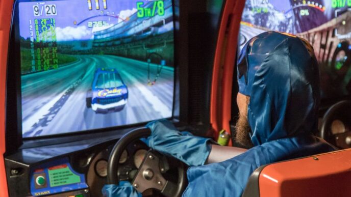 man in blue jacket driving car