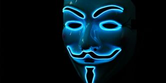 a person wearing a blue mask with a black background