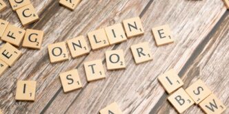 scrabble letters spelling online store on a wooden surface