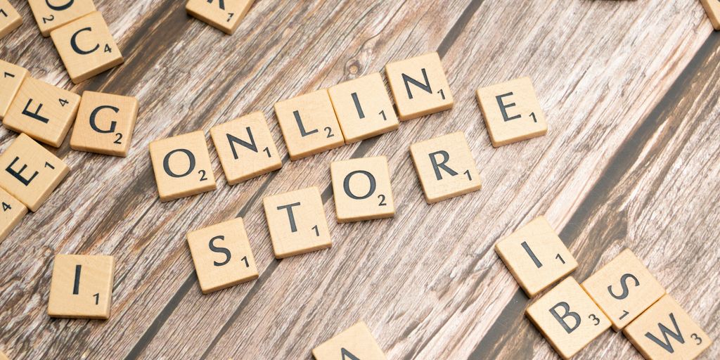 scrabble letters spelling online store on a wooden surface