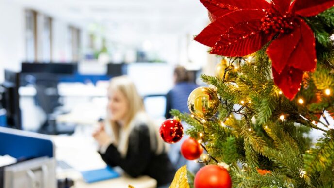 A decorated christmas tree in an office cubicle
