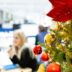 A decorated christmas tree in an office cubicle