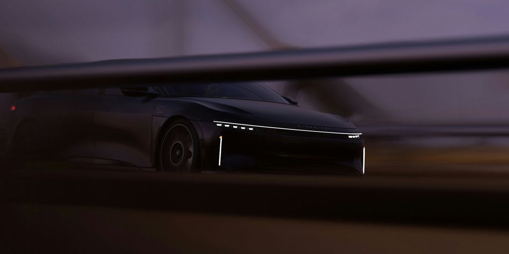 a car is seen through a window at night